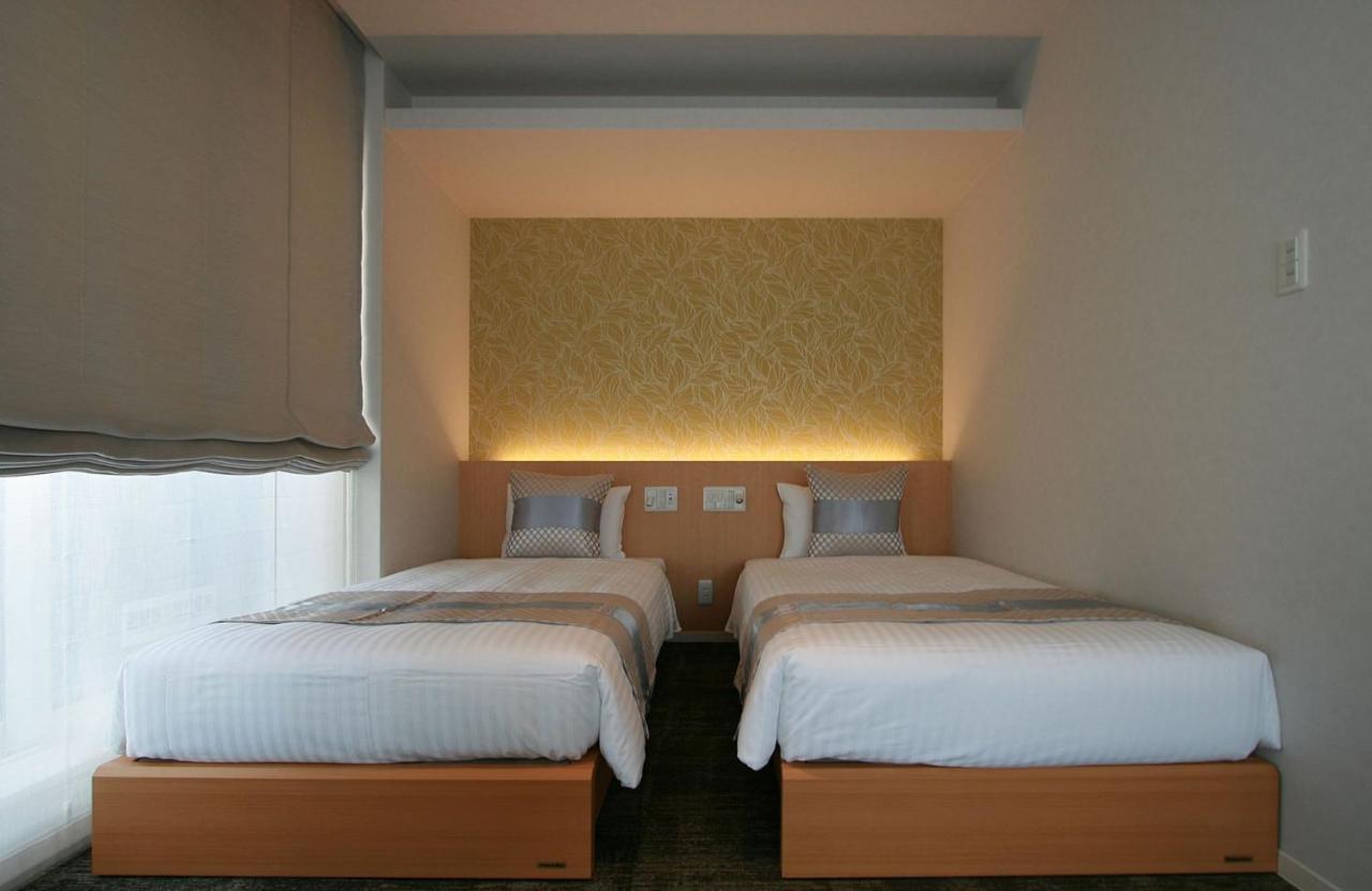 Grand Base Okayama Ekimae Aparthotel Luaran gambar