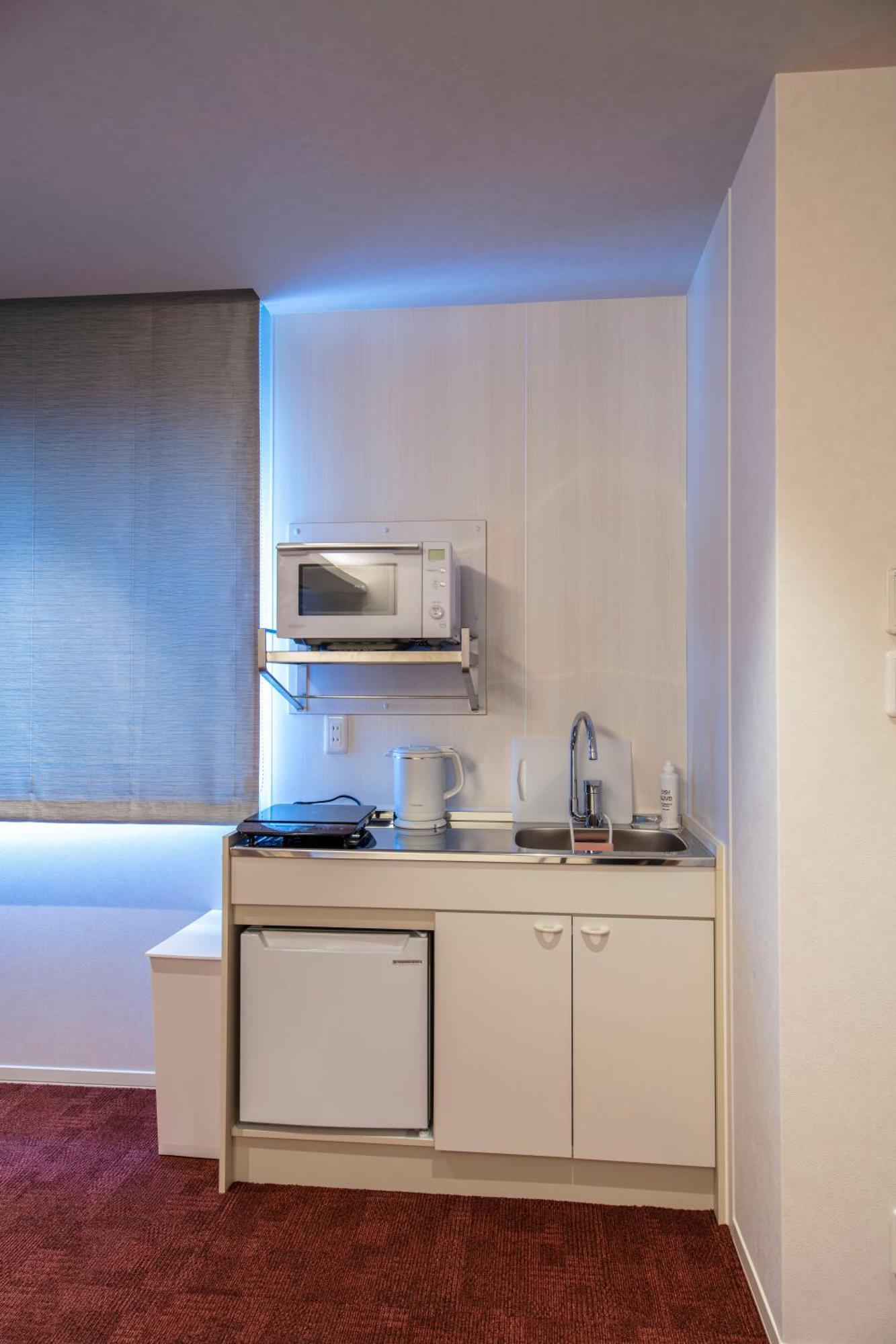 Grand Base Okayama Ekimae Aparthotel Luaran gambar